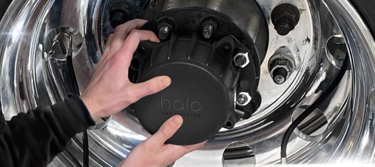 An image of a person installing a Halo Tire Inflator on a wheel